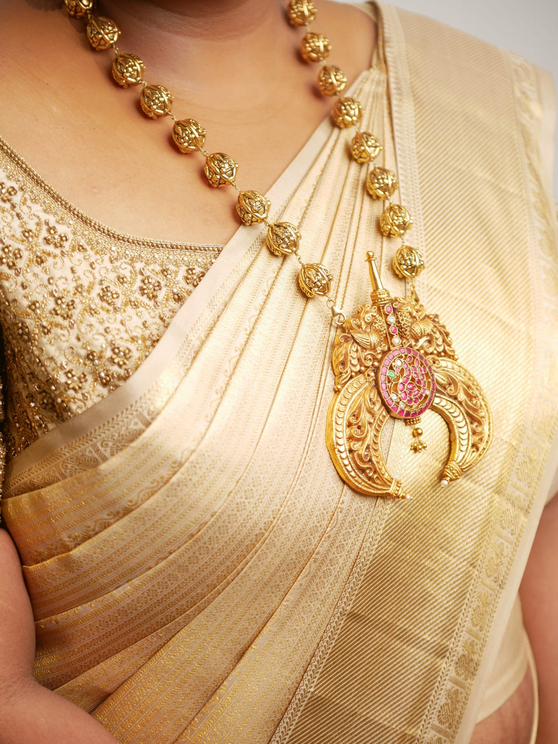 A custom gold plated ball haaram