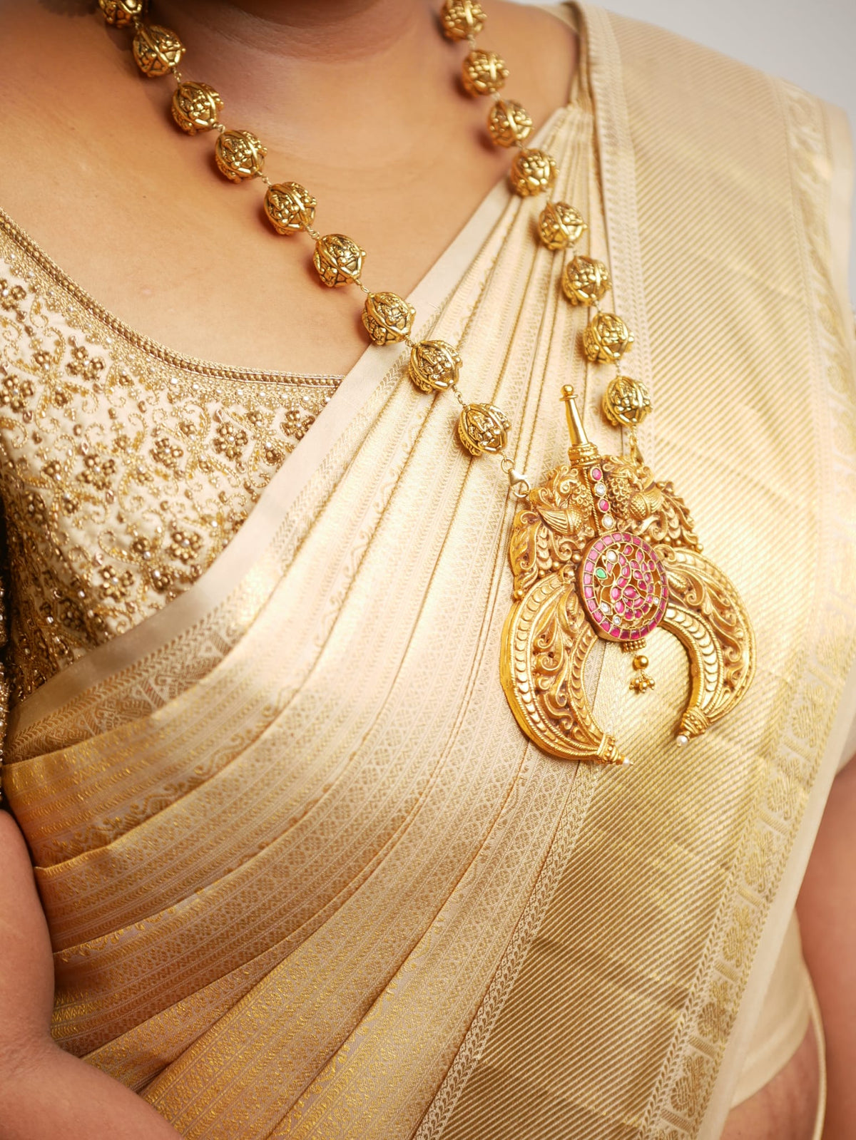 A custom gold plated ball haaram