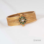 Intricated kada with green stone flower