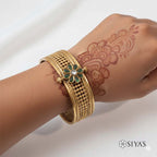 Intricated kada with green stone flower
