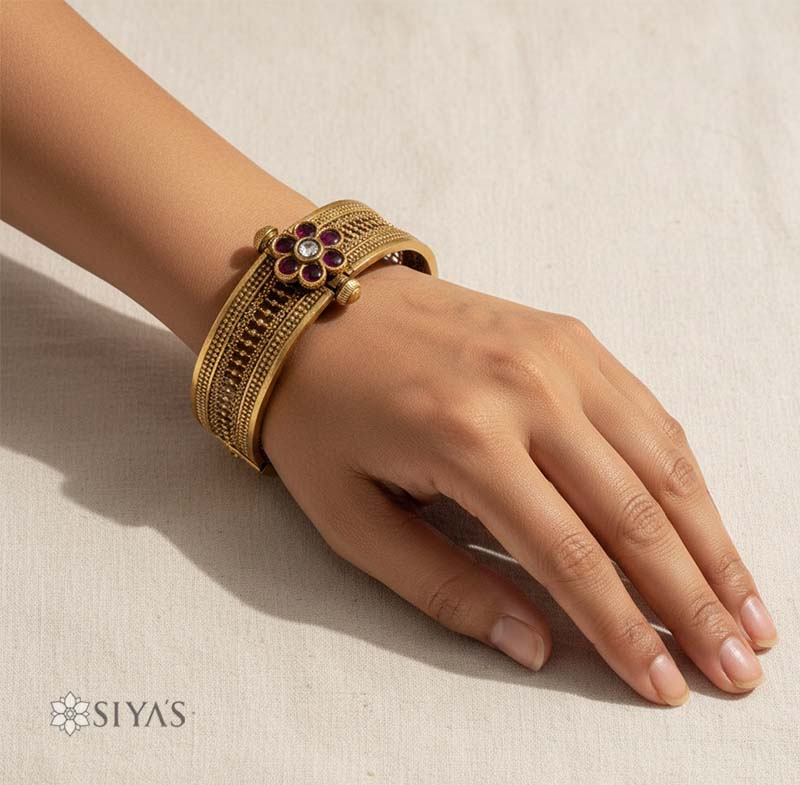 Intricated kada with red stone flower