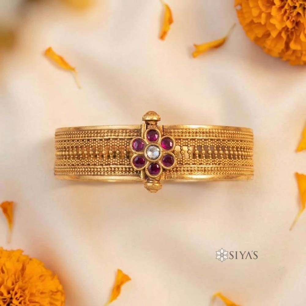 Intricated kada with red stone flower