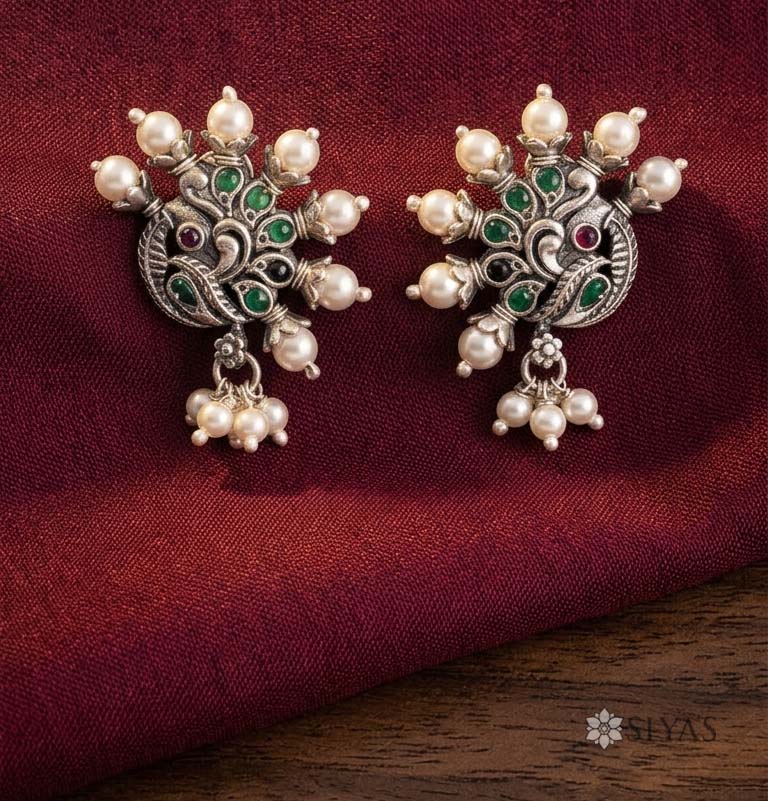 Peacock studs with pearl feathers