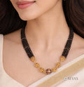 Black beads with gold gundu chain