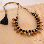 Black thread with gold motifs