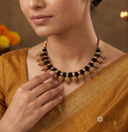 Black thread with gold motifs