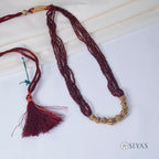 Red beads with small gold gundus