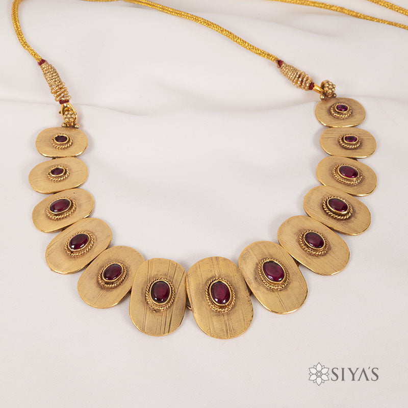 Tribal oval with red stones