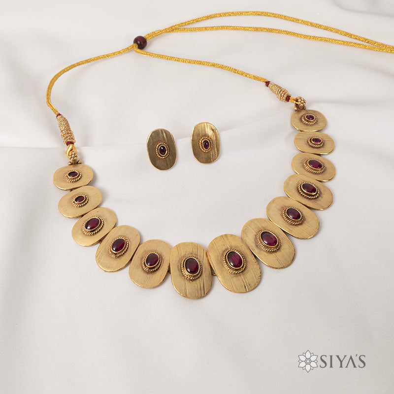 Tribal oval with red stones