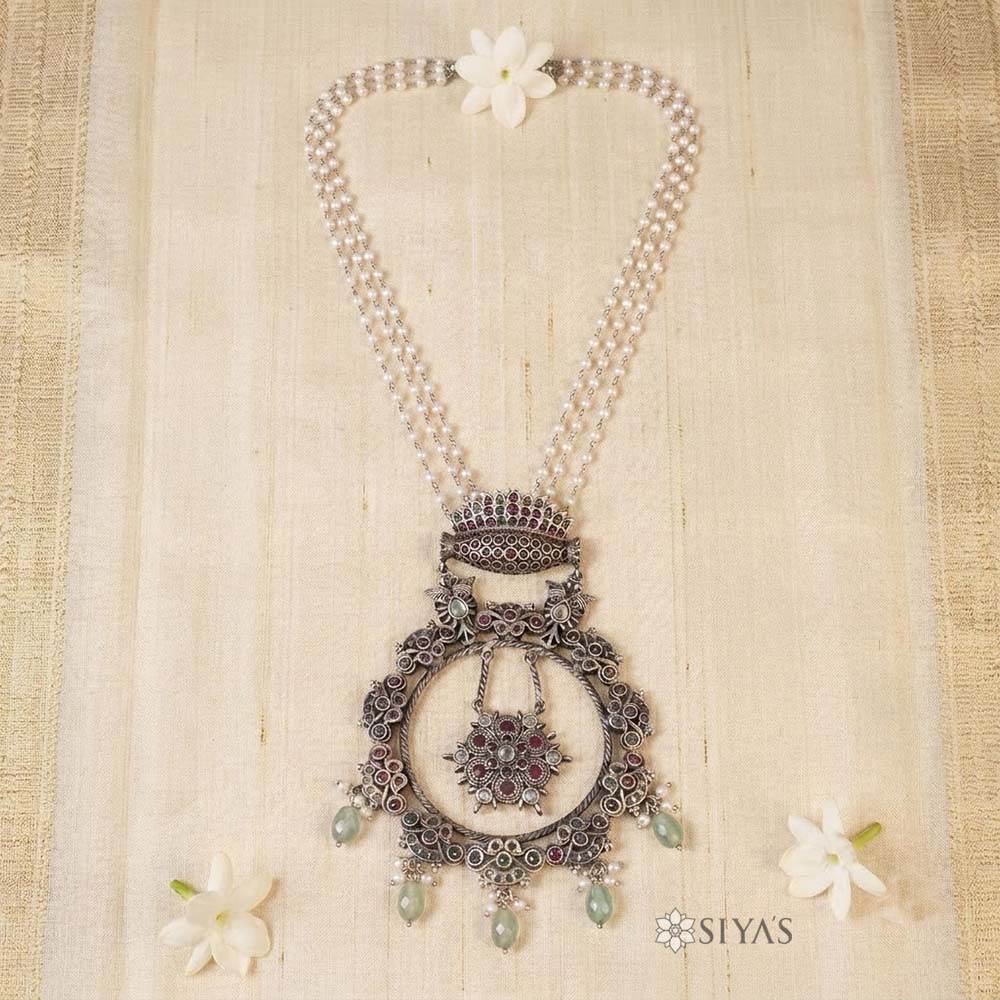 Pearl chain with round ruby pendant