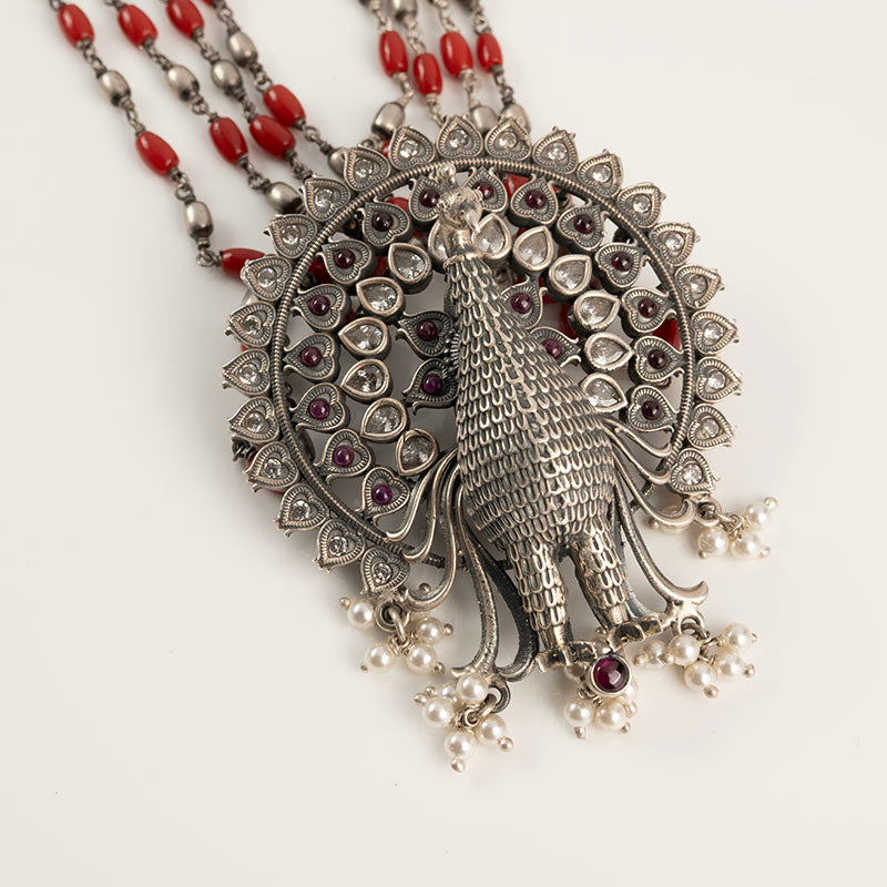 Peacock with coral long chain