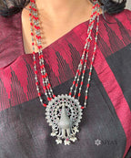 Peacock with coral long chain