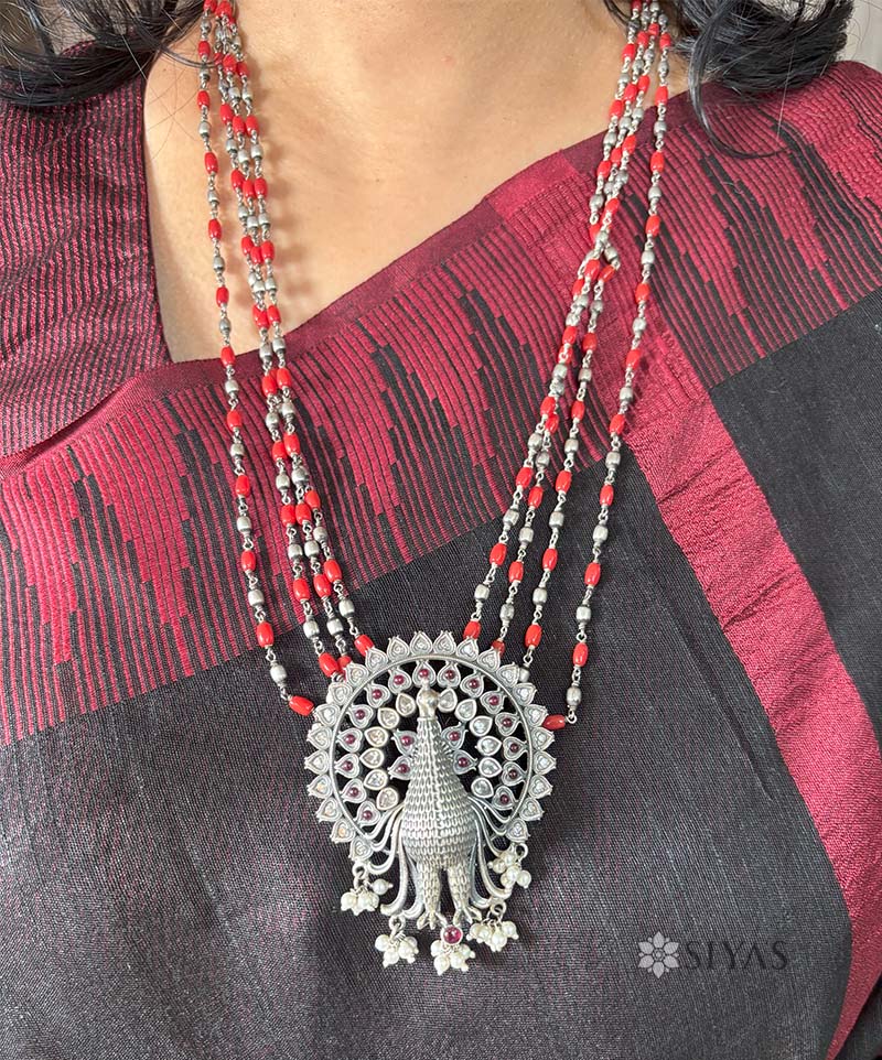 Peacock with coral long chain